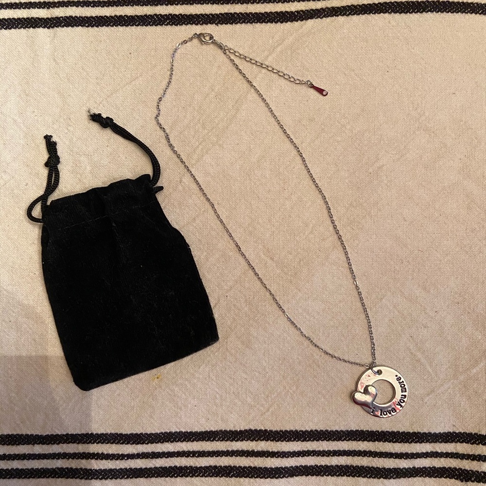 Silver necklace with “i love you more” charm